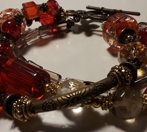 Bracelete, bronze gold and red color.